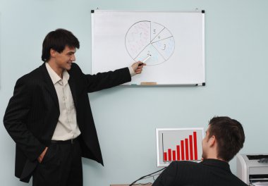 Two buisnessmen discussing the growth diagram clipart