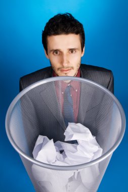 Young businessman playing baskteball with crumpled paper clipart