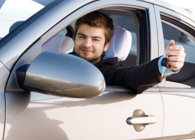 Young man driving a car clipart