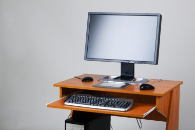 Modern personal computer on a table clipart