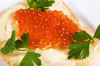 Red caviar with bread and butter clipart