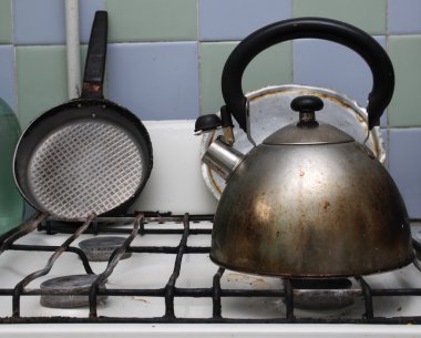 Gas stove with kettle on it clipart