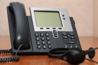 IP Phone with headset clipart