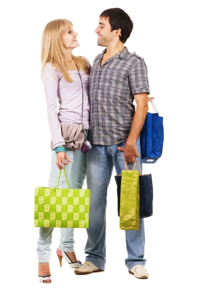 Piękna młoda para z torby na zakupy — Zdjęcie stockowe