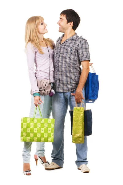 Güzel genç bir çift ile alışveriş torbaları — Stok fotoğraf