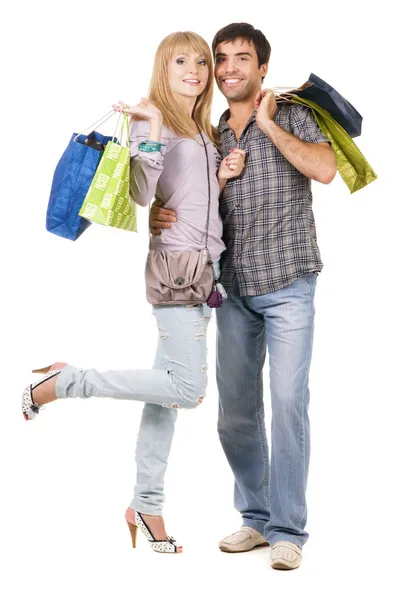 Gyönyörű fiatal pár bevásárló táskák — Stock Fotó