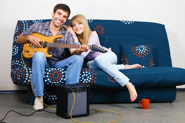 Cheerful couple resting at home — Stock Photo, Image