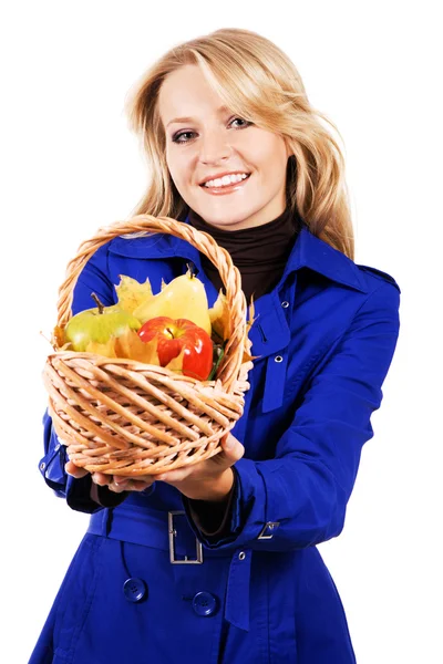 Lovely woman with a basket of ripe fruit — Stock Photo, Image