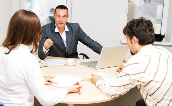 Financial adviser and his customers — Stock Photo, Image