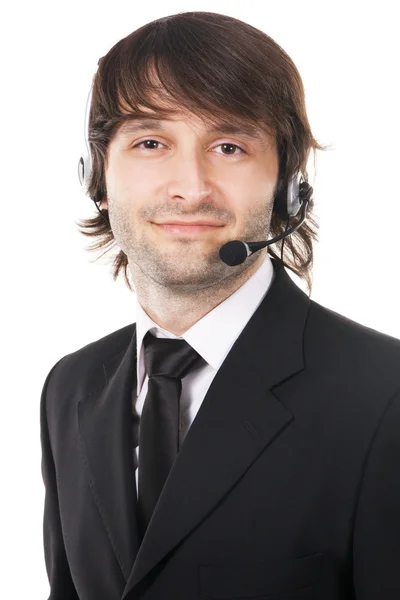 Happy young businessman with headset — Stock Photo, Image
