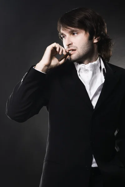 Elegant handsome man with cigar — Stock Photo, Image