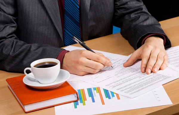 Businessman's table covered with documents — Stock Photo, Image