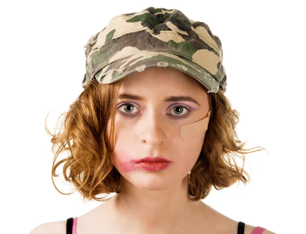 Mujer joven con maquillaje manchado un yeso en la mejilla —  Fotos de Stock
