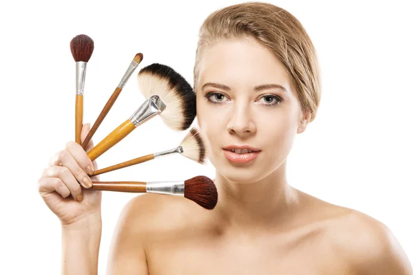 Woman with makeup brushes — Stock Photo, Image