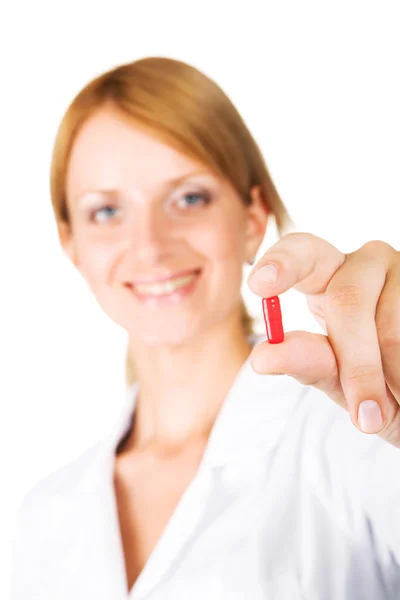 Stock image Young attractive doctor holding a pill