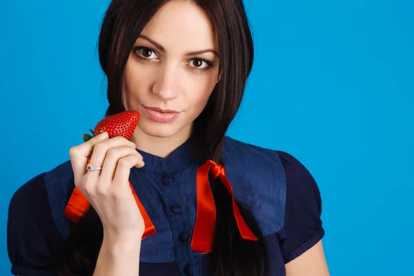Beautiful lady holding a strawberry — Stock Photo, Image