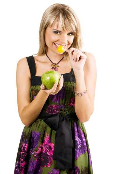 Krásná mladá žena s bonbóny a apple — Stock fotografie