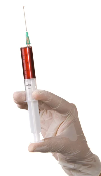 Verpleegster de hand met een injectiespuit — Stockfoto