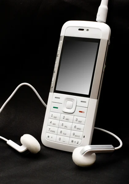 Белый мобильный телефон — стоковое фото
