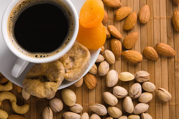 stock image Coffee with nuts, fig and dried apricots