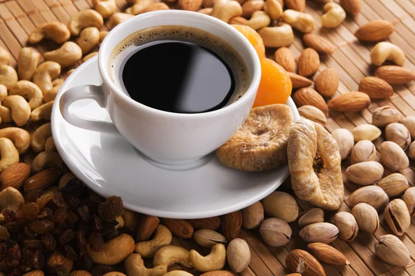 Coffee with nuts, fig and dried apricots — Stock Photo, Image