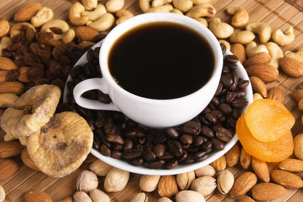 Coffee with nuts, fig and dried apricots — Stock Photo, Image