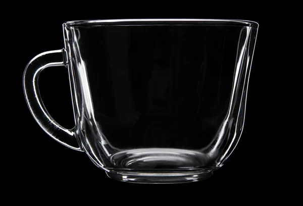Glas cup på svart — Stockfoto