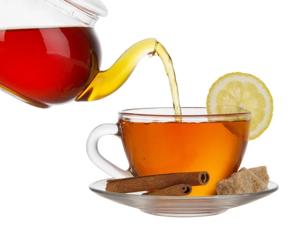 Black tea with cane-sugar, lemon and cinnamon — Stock Photo, Image