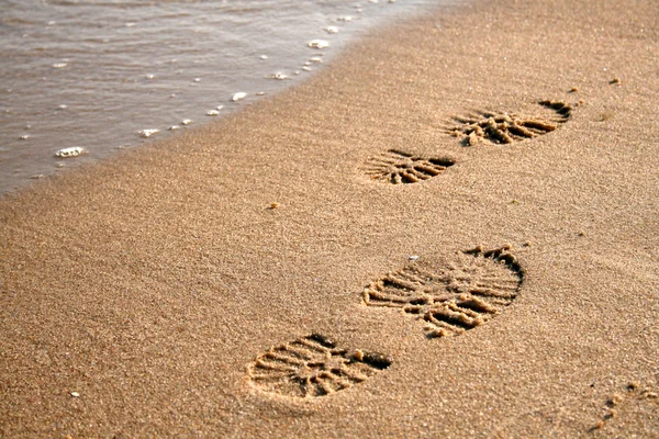 stock image Footprints on the sand