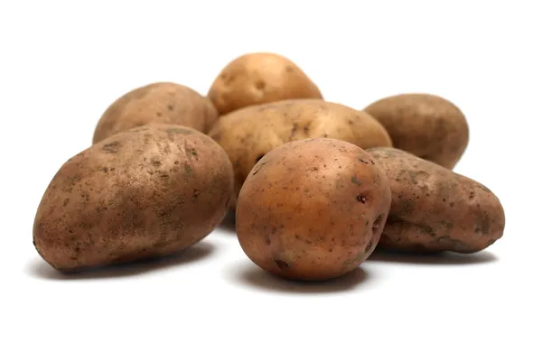 Stapel biologischer roher Kartoffeln — Stockfoto