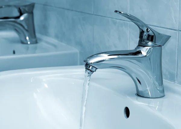 Water running from a faucet — Stock Photo, Image