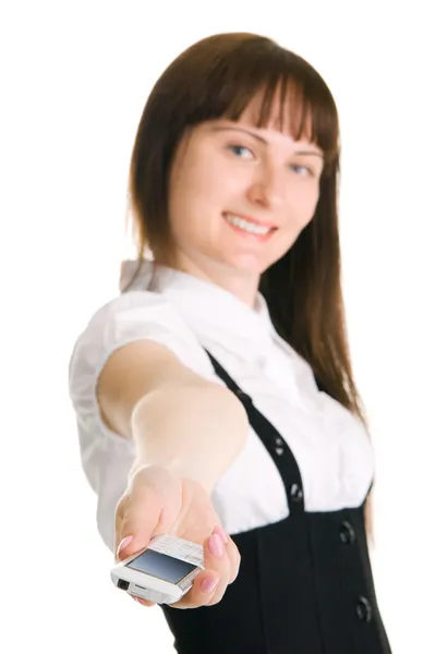 Young businesswoman holding out a mobile phone — Stock Photo, Image