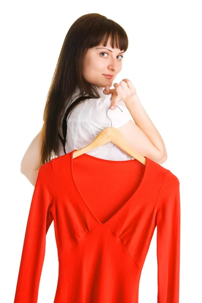 Beautiful lady trying on a red dress — Stock Photo, Image