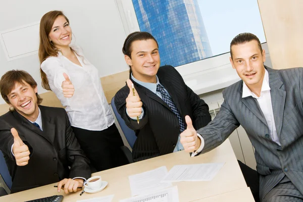 Successful business team showing thumbs up Royalty Free Stock Images