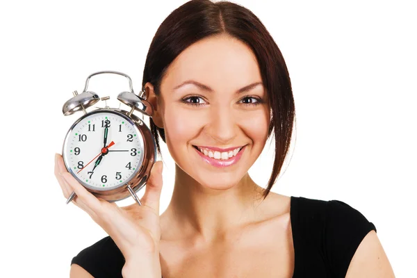 Cheerful woman with alarm clock Stock Image
