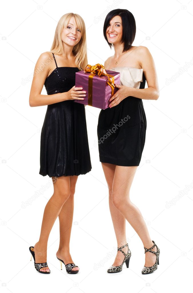 Pretty festive girls with a gift box
