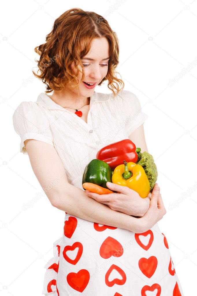 Young beautiful woman with a bunch of fresh vegatables