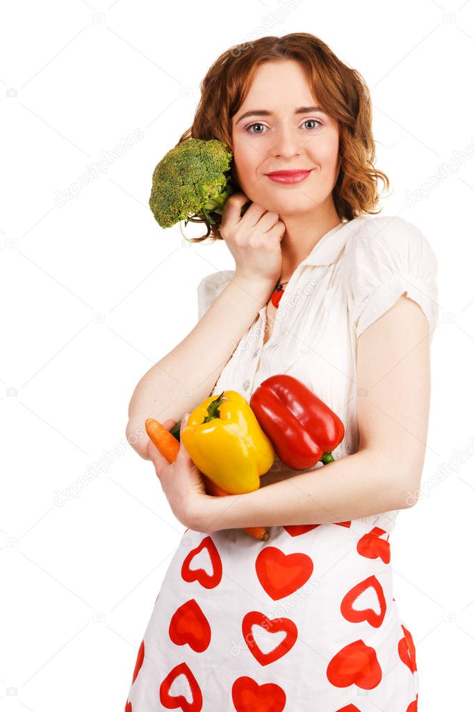 Beautiful housewife with a bunch of fresh vegetables