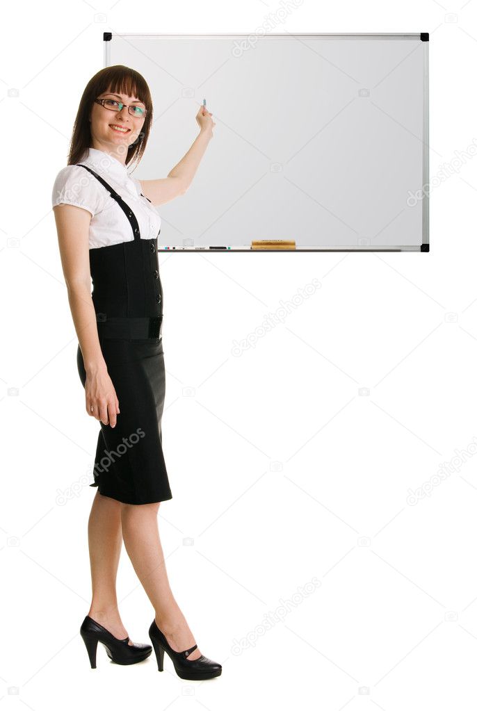 Young woman in businesssuit pointing on whiteboard