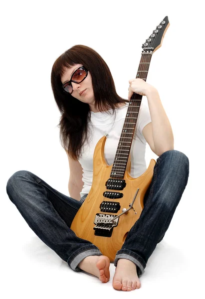 Pretty young girl holding an electric guitar — Stock Photo, Image