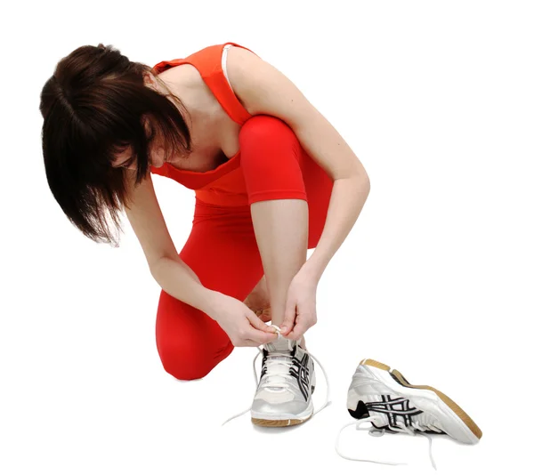 Femme serrant ses chaussures de jogging — Photo