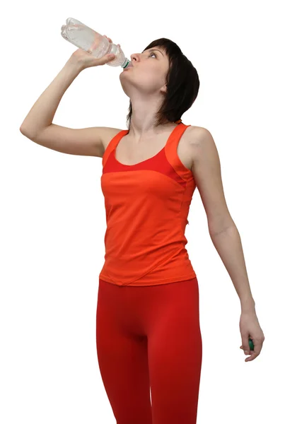 Женщина в спортивном костюме питьевая вода — стоковое фото