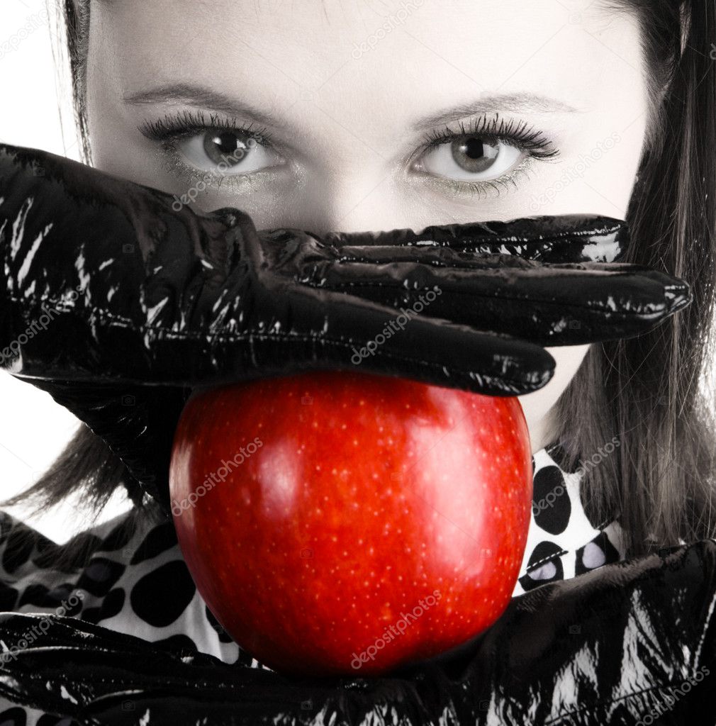 Gorgeous woman holding a red apple