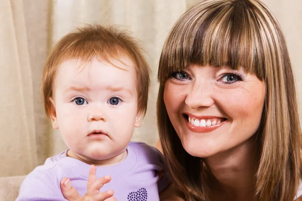 Happy mother with cute little daughter — Stock Photo, Image