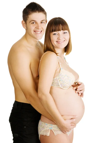 Feliz joven pareja esperando un bebé —  Fotos de Stock