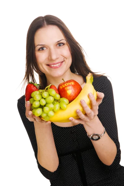 Mulher bonita com um monte de frutas — Fotografia de Stock