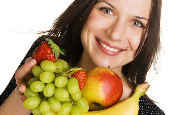 Güzel bir genç kadın bir sürü meyve — Stok fotoğraf