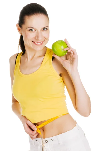 Schöne schlanke Frau hält einen grünen Apfel — Stockfoto