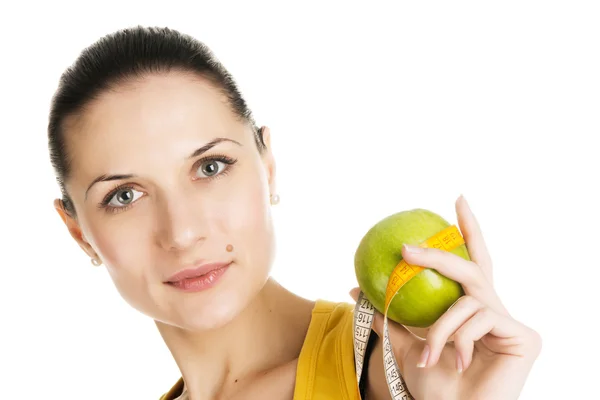 Krásná štíhlá žena držící zelené jablko — Stock fotografie
