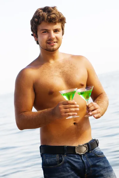 Sexy man with two drinks — Stock Photo, Image